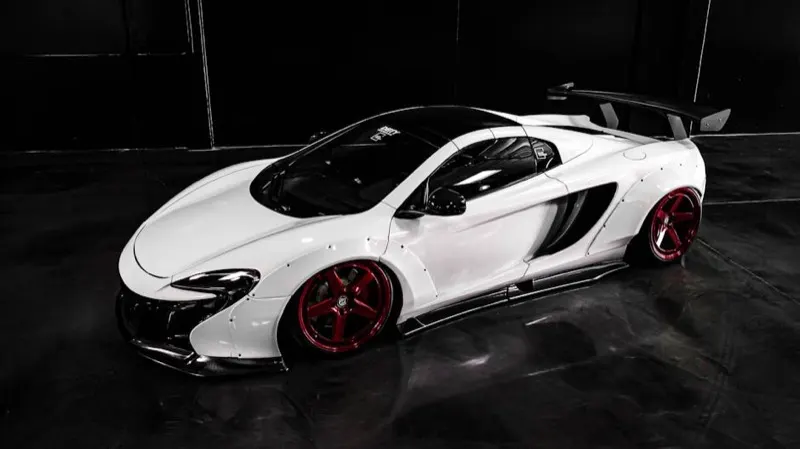 McLaren 650S in white with carbon-fibre aero, studio photograph at three-quarter angle