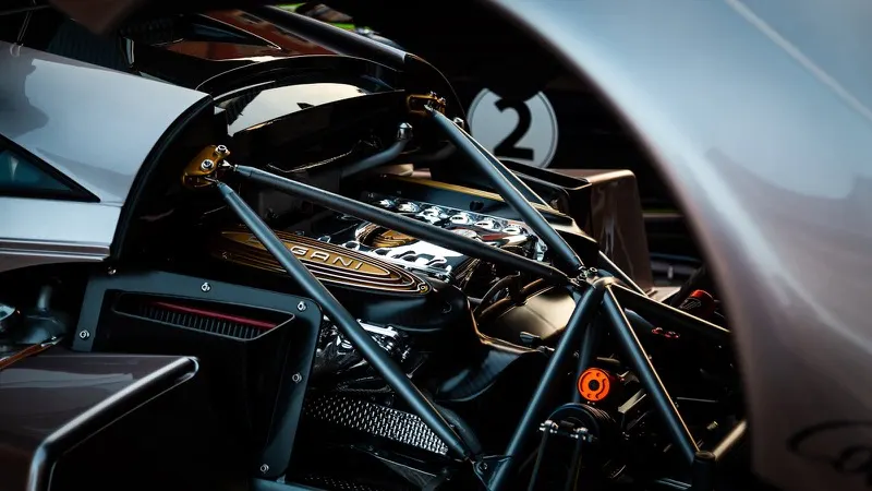Pagani Huayra engine bay detail showing chrome intake and carbon rollcage